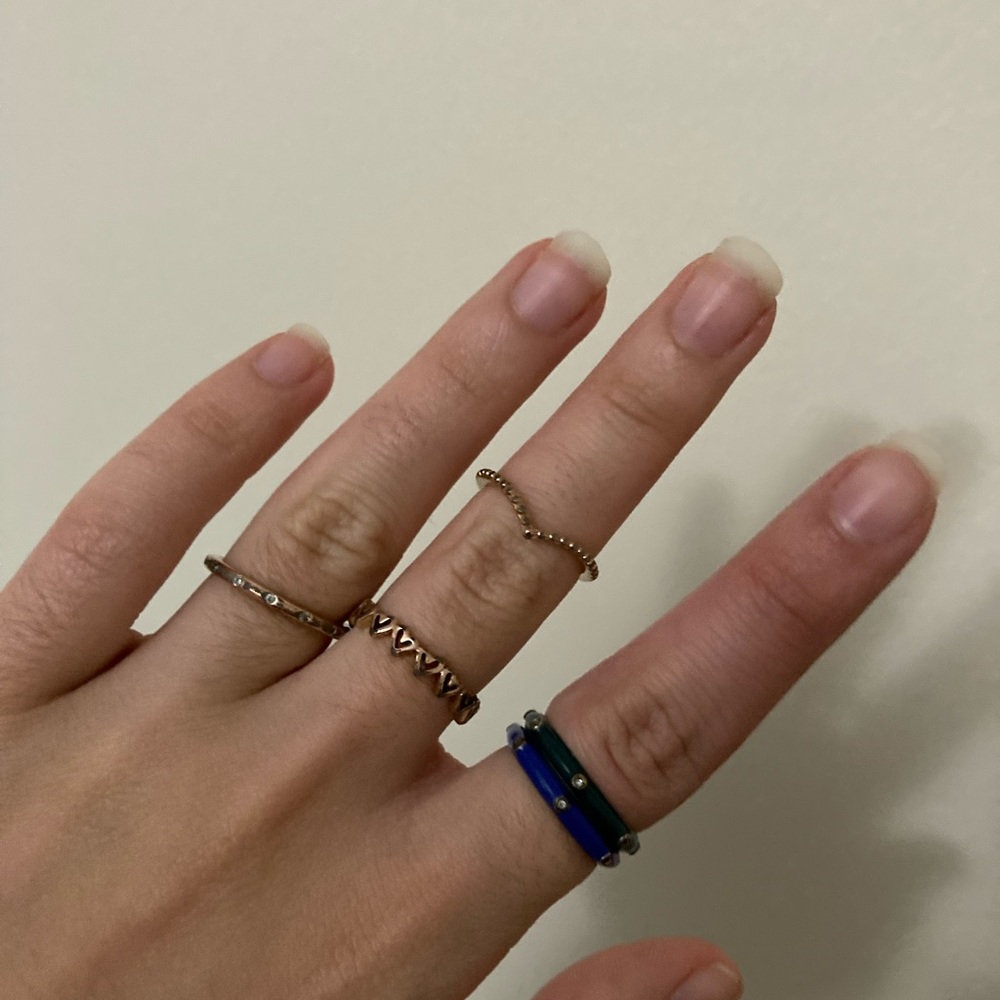 Three size 7 rose gold plated pandora rings and two random rings